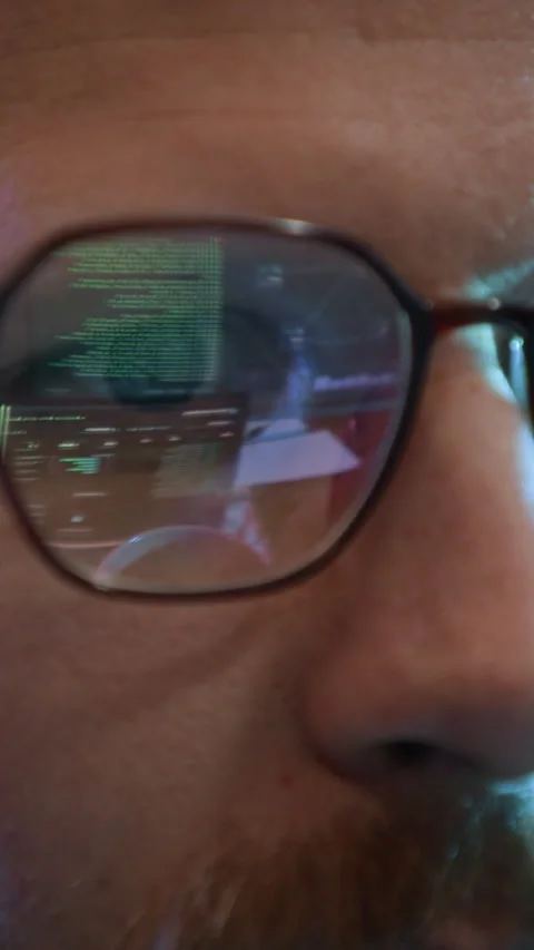 Network Engineer Wearing Glasses Reflecting Programming Codes Indoors 動画素材 334928470