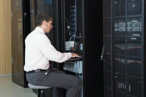 Network Engineer Working In Server Room Stock Photos