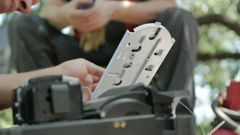 A network engineer works with optical fiber equipment Stock Footage 112241380