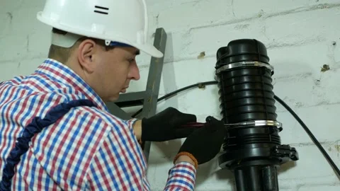 A network engineer works with optical fiber equipment Stock Footage 150634870