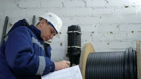 A network engineer works with optical fiber equipment Stock Footage 150635450