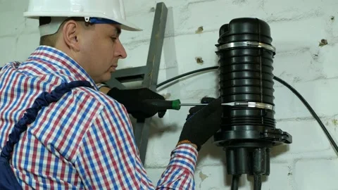 A network engineer works with optical fiber equipment Stock Footage 150643149