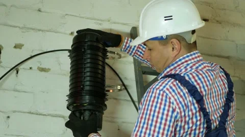 A network engineer works with optical fiber equipment Stock Footage 150683324