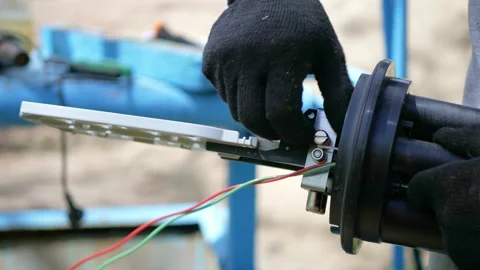 A network engineer works with optical fiber equipment Stock Footage 156524565