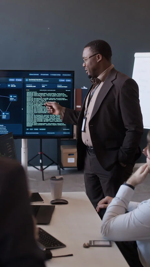 Network Engineers Analyzing Programming Codes during Briefing in Office 動画素材 334936306
