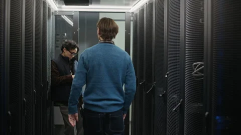 Network Engineers Shaking Hands after Server Maintenance in Data Center Stock Footage 330547250