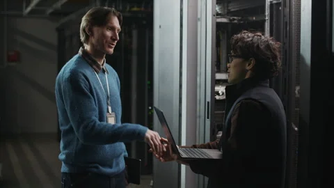 Network Engineers Shaking Hands after Server Installation in Data Center Stock Footage 330547549