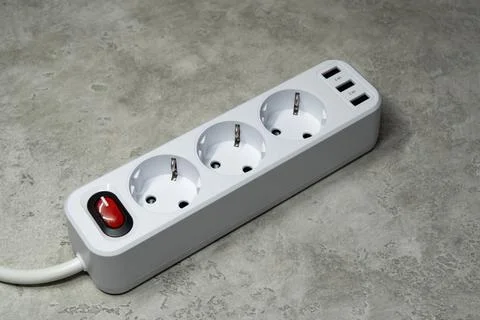 Network filter. Extension cord tee with three sockets and three USB ports Foto stock