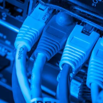 Network hub and patch cables Stock Photos