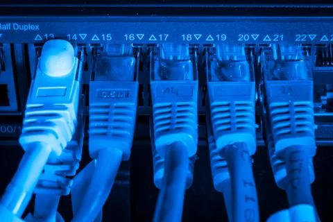 Network hub and patch cables Stock Photos