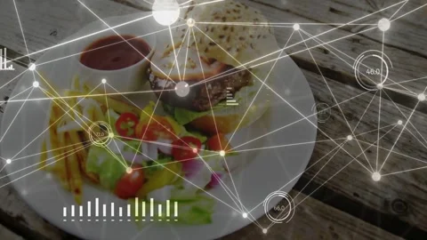Network overlay activating over plate on wood table, nodes moving and charts Stock Footage 333078077