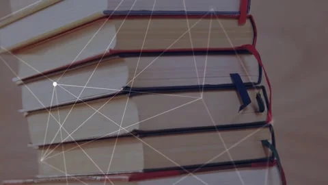 Network overlay appearing as camera lifting connecting nodes across book stack Stock Footage 334728645