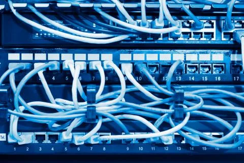 Network panel, switch and cable in blue tone. selective focus Stock Photos
