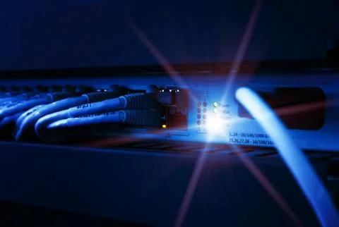 Network panel, switch and cable in data center Stock Photos
