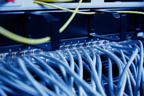 Network panel, switch and cable in data center Stock Photos