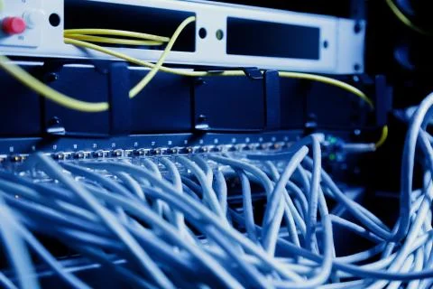 Network panel, switch and cable in data center Stock Photos