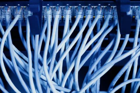 Network panel, switch and cable in data center Stock Photos
