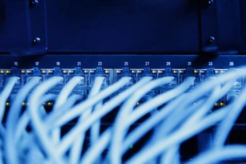 Network panel, switch and cable in data center Stock Photos