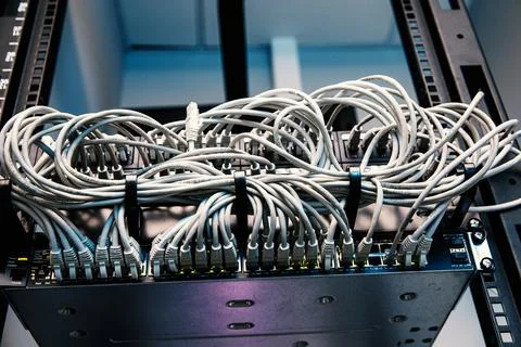 Network panel, switch and cables in data center. Stock Photos
