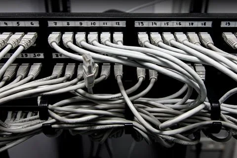 Network panel, switch and cables in data center. Foto stock