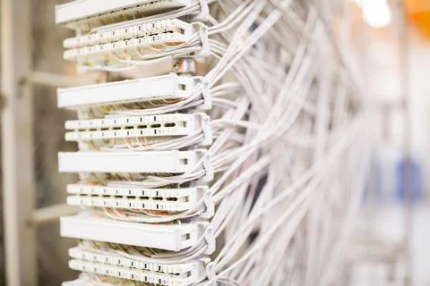 Network patch panel is being shown close-up in 3D render with Ethernet cables Stock Photos
