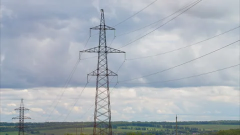 A Network of Power Lines Silhouetted Against a Stunningly Dramatic and Colorful Video stock 317611838