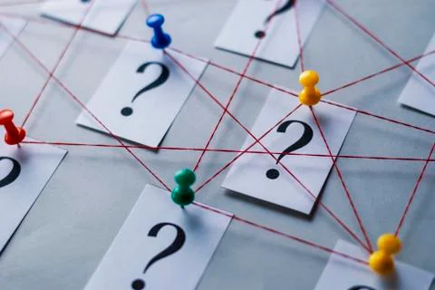 Network of printed question marks on white cards Foto stock