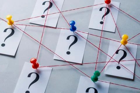 Network of printed question marks on white cards Stock Photos