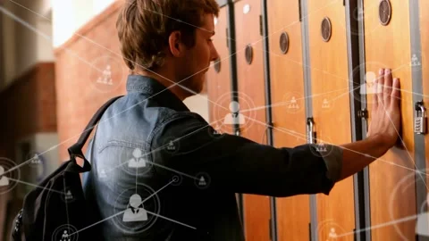 Network of profile icons against caucasian boy opening his locker at college Stock Footage 328356830