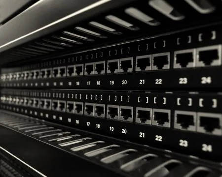 Network RJ-45 patch panel in the switching center. Close up view with selecti Stock Photos