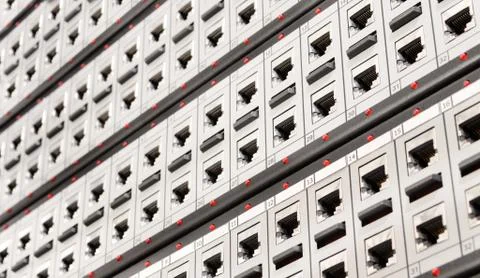 Network RJ-45 patch panel with switches in switching center. Close up view fr Stock Photos