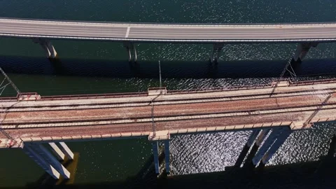 Network of roads and rails above water during daylight hours Stock Footage 338276500