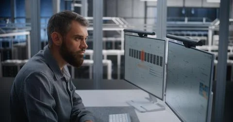 Network Security Specialist Responding to DDoS Threat inside High Capacity Data Stock Photos