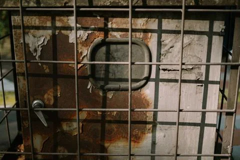 A network server in a public space, securely enclosed in a metal cage, high.. Stock Photos