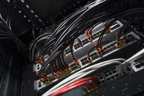 Network server room closeup on fiber optic hub or switch for digital Stock Photos