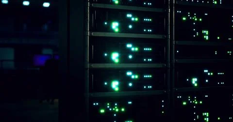 Network server room displaying vibrant lights and technology at night Stock Illustration