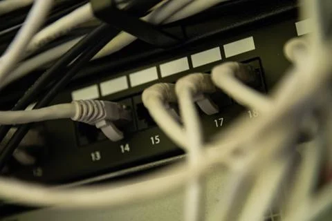 Network switch and ethernet cable connect to computer Stock Photos