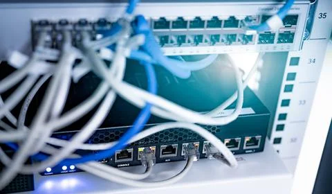 Network switch and ethernet cable in data center. Wifi plug of internet route Stock Photos