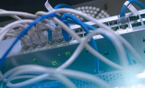 Network switch and ethernet cable in data center. Wifi plug of internet route Stock Photos