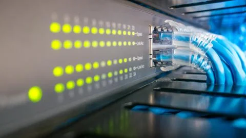 Network switch and ethernet cables connected Stock Photos