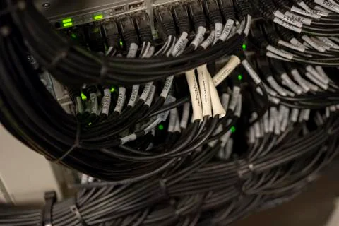 Network Switch and Ethernet Cables Patched into Local Network and IPTV Stock Photos