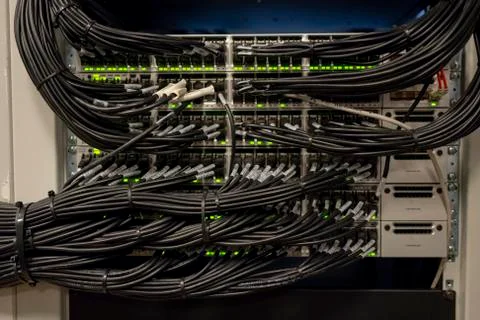 Network Switch and Ethernet Cables Patched into Local Network and IPTV Stock Photos