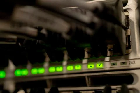 Network Switch and Ethernet Cables Patched into Local Network and IPTV Stock Photos