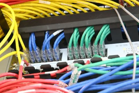 Network switch and patch cables Stock Photos