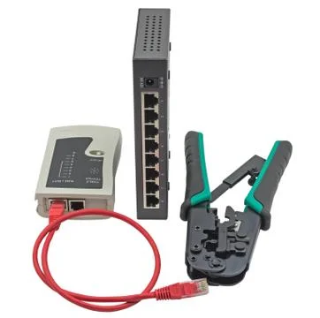 Network switch, ethernet cable, crimper and RJ45 cable tester isolated on whi Foto stock