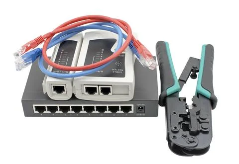 Network switch, ethernet cable, crimper and RJ45 cable tester Stock Photos