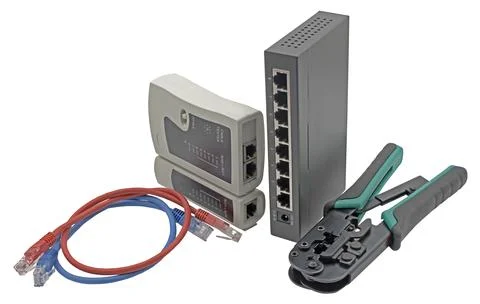 Network switch, ethernet cable, crimper and RJ45 cable tester Stock Photos