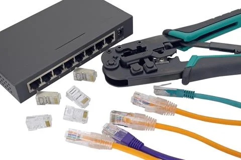 Network switch, ethernet cable, crimper isolated on white Stock Photos