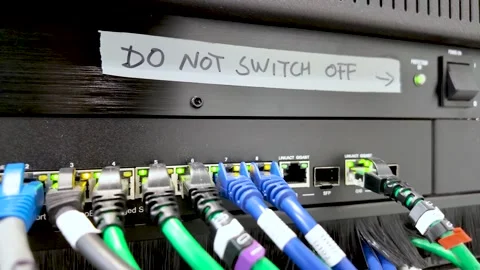 Network switch with ethernet cables and do not switch off warning Stock Footage 328153025