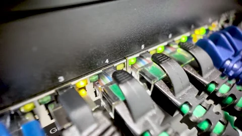Network switch with ethernet cables connecting data ports. macro shot, dolly Stock Footage 328143132